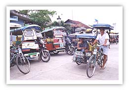 Tricycle transportation, Philippines. Photo copyright TJC.
